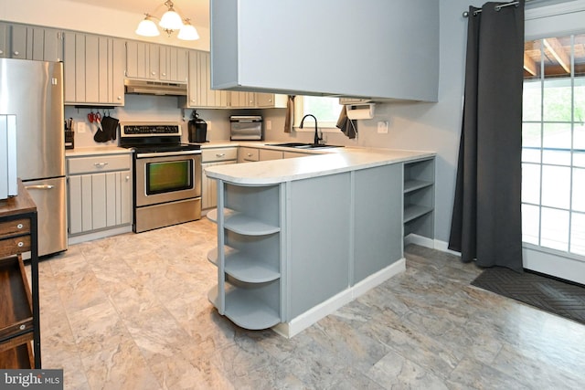 kitchen featuring light countertops, under cabinet range hood, a sink, open shelves, and stainless steel appliances