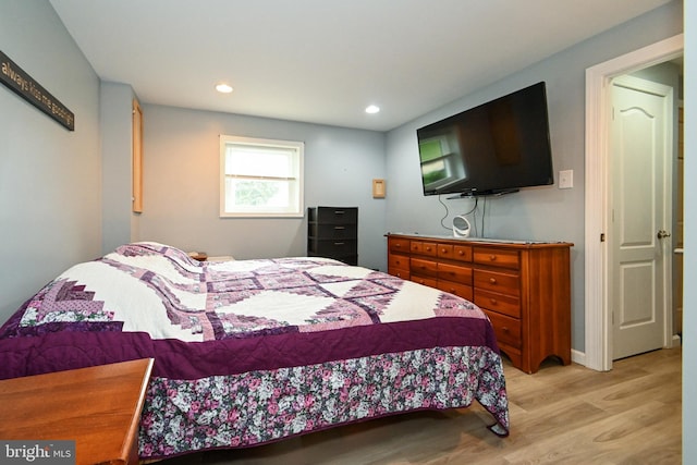 bedroom with light wood-style flooring and recessed lighting