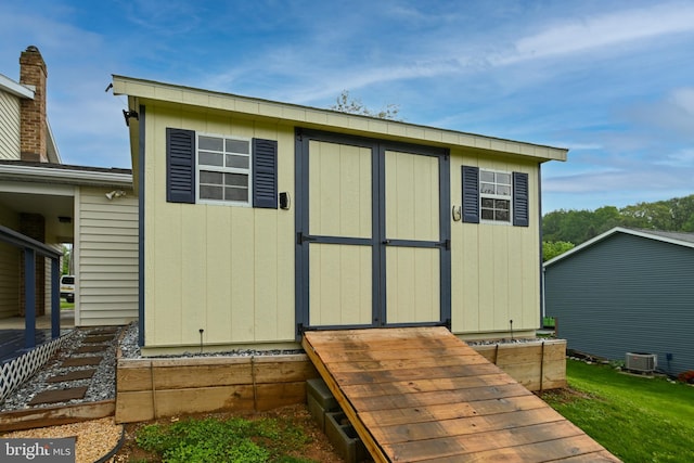 view of shed with central AC unit