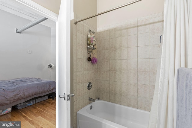 2200 Arch St Unit 409, Philadelphia, PA 19103 - bathroom featuring wood finished floors and shower / bath combination with curtain