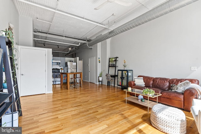2200 Arch St Unit 409, Philadelphia, PA 19103 - living room with ceiling fan and wood finished floors