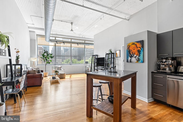 2200 Arch St Unit 409, Philadelphia, PA 19103 - kitchen with light wood-style floors, a high ceiling, and dishwasher