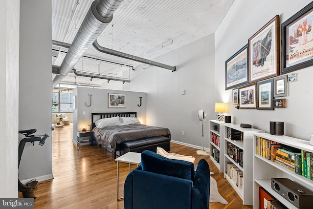 2200 Arch St Unit 409, Philadelphia, PA 19103 - bedroom featuring baseboards and wood finished floors