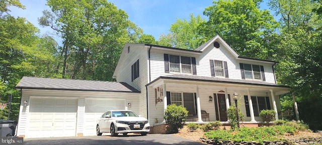 9190 Balsam Run, Bel Alton, MD 20611 - view of front of home featuring covered porch, driveway, and a garage