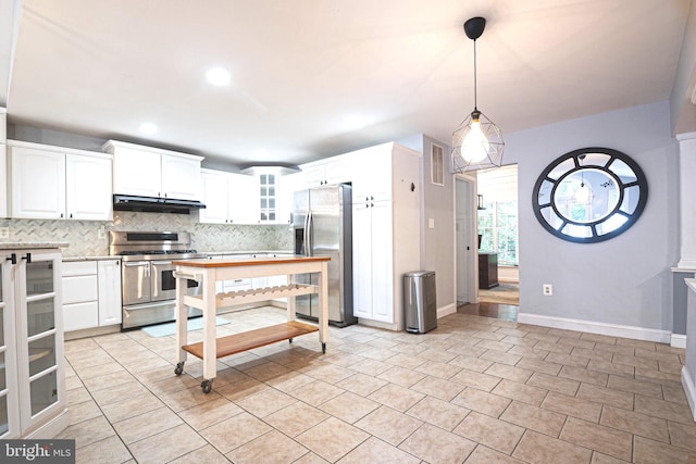9190 Balsam Run, Bel Alton, MD 20611 - kitchen featuring stainless steel appliances, under cabinet range hood, backsplash, glass insert cabinets, and white cabinets