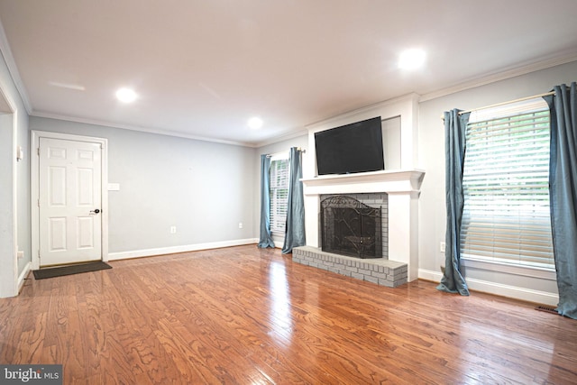 9190 Balsam Run, Bel Alton, MD 20611 - unfurnished living room featuring a wealth of natural light, a brick fireplace, and ornamental molding