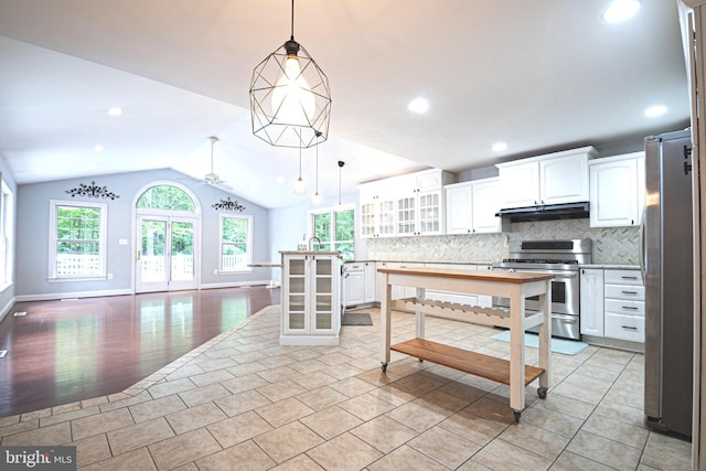 9190 Balsam Run, Bel Alton, MD 20611 - kitchen with a ceiling fan, lofted ceiling, glass insert cabinets, backsplash, and appliances with stainless steel finishes