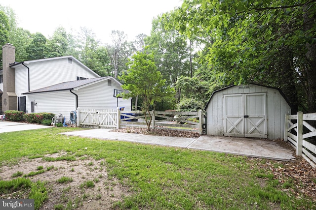 9190 Balsam Run, Bel Alton, MD 20611 - view of yard featuring a gate, fence, a storage shed, and an outbuilding