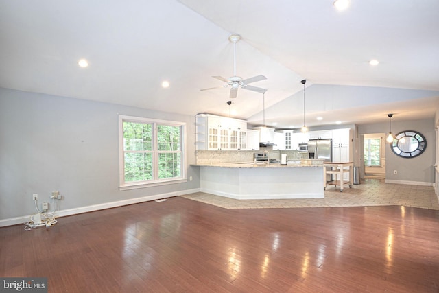 9190 Balsam Run, Bel Alton, MD 20611 - unfurnished living room featuring a sink, lofted ceiling, hardwood / wood-style floors, ceiling fan, and baseboards