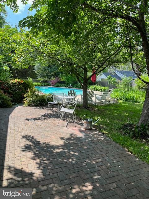 view of patio / terrace with an outdoor pool
