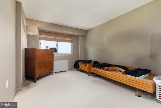 living area featuring light carpet