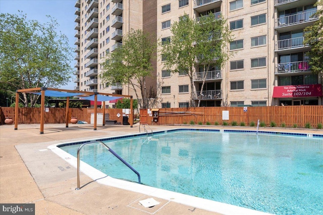 community pool featuring fence