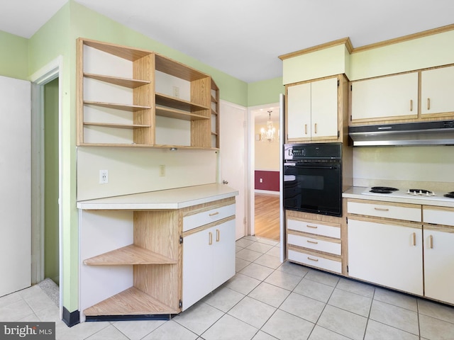 kitchen with oven, open shelves, under cabinet range hood, light countertops, and white electric cooktop