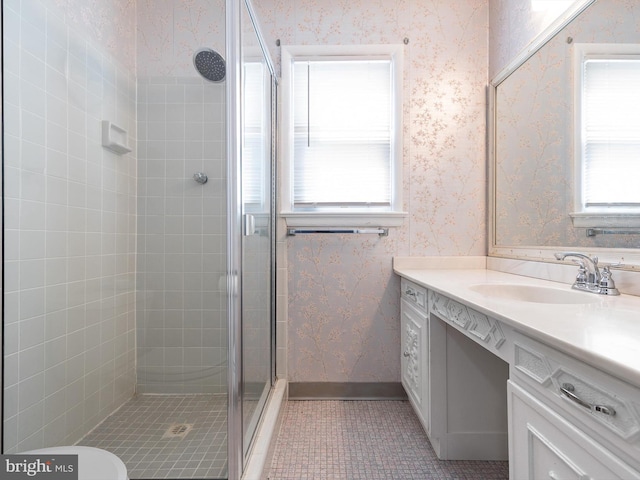 bathroom with a shower stall, tile patterned flooring, wallpapered walls, and plenty of natural light
