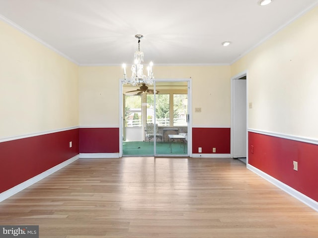 unfurnished dining area with a notable chandelier, recessed lighting, baseboards, ornamental molding, and wood finished floors