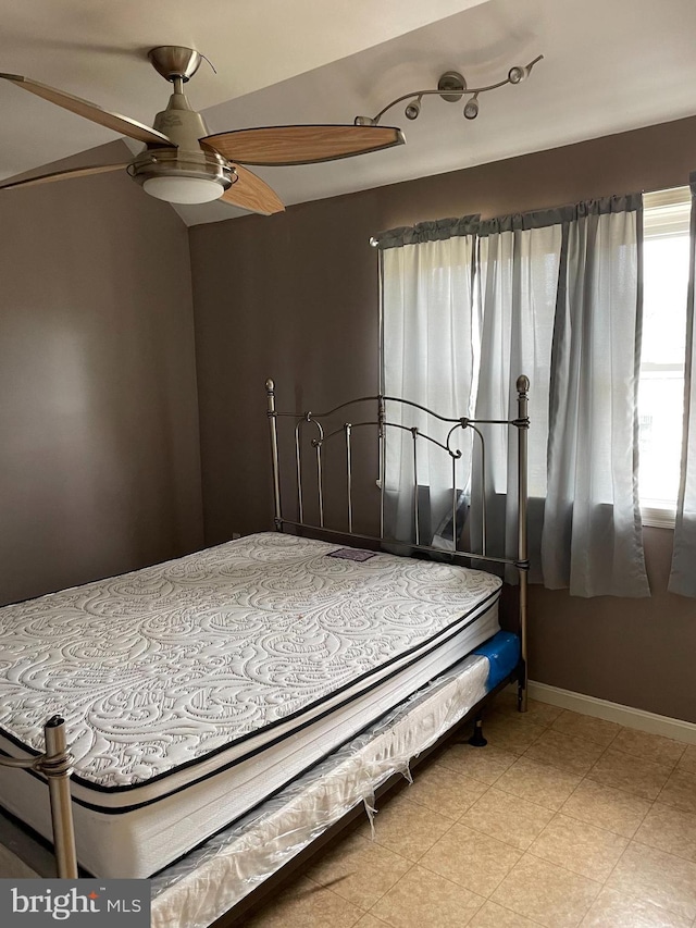 bedroom featuring baseboards