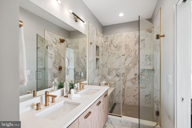 670 N 13th St, Philadelphia, PA 19123 - bathroom with marble finish floors, a marble finish shower, double vanity, and recessed lighting