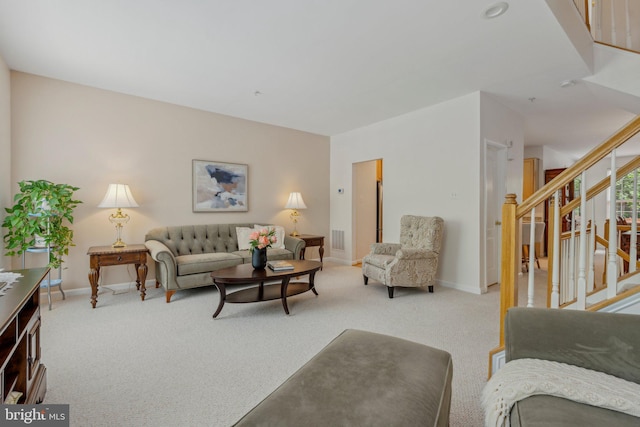13669 Harvest Glen Way, Germantown, MD 20874 - living area featuring stairway, baseboards, and carpet floors