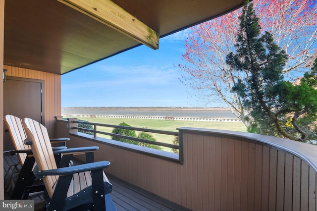 balcony featuring a water view