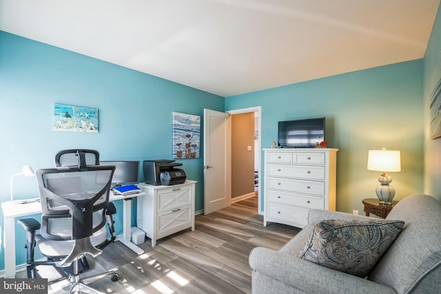 office with light wood finished floors and baseboards
