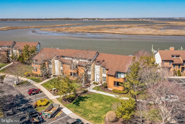 aerial perspective of suburban area with a large body of water