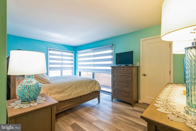bedroom featuring light wood-style flooring