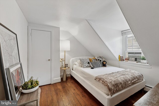 328 S Juniper St, Philadelphia, PA 19107 - bedroom with vaulted ceiling, baseboard heating, and dark wood-style floors
