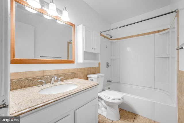 full bathroom featuring vanity, toilet, tile patterned flooring, and  shower combination