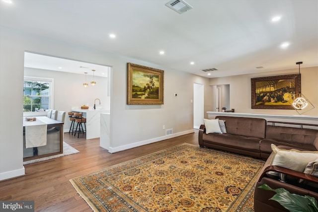 101 Oakmont Ct NE, Vienna, VA 22180 - living area featuring wood finished floors, recessed lighting, and baseboards