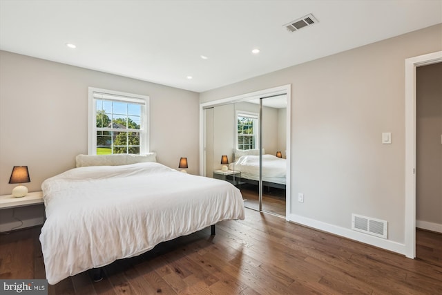 101 Oakmont Ct NE, Vienna, VA 22180 - bedroom featuring multiple windows, a closet, wood finished floors, recessed lighting, and baseboards