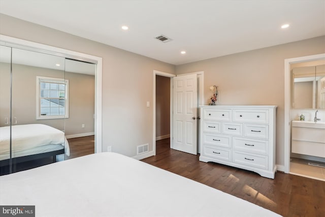 101 Oakmont Ct NE, Vienna, VA 22180 - bedroom with dark wood-type flooring, baseboards, recessed lighting, and a closet