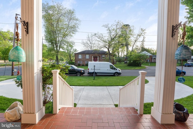 101 Oakmont Ct NE, Vienna, VA 22180 - covered porch featuring a yard