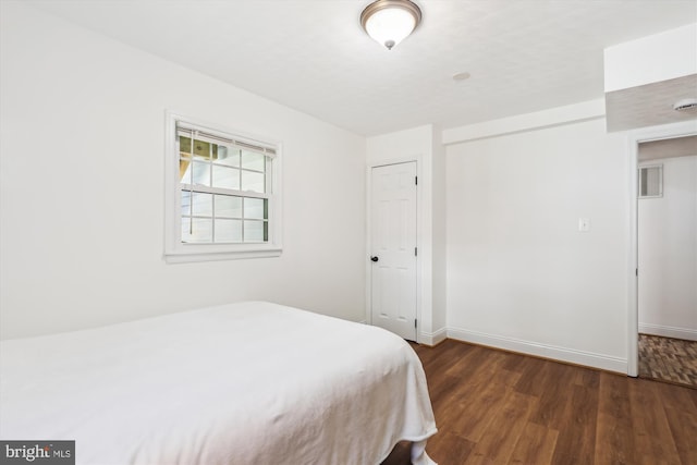 101 Oakmont Ct NE, Vienna, VA 22180 - bedroom featuring dark wood-type flooring, baseboards, and a closet