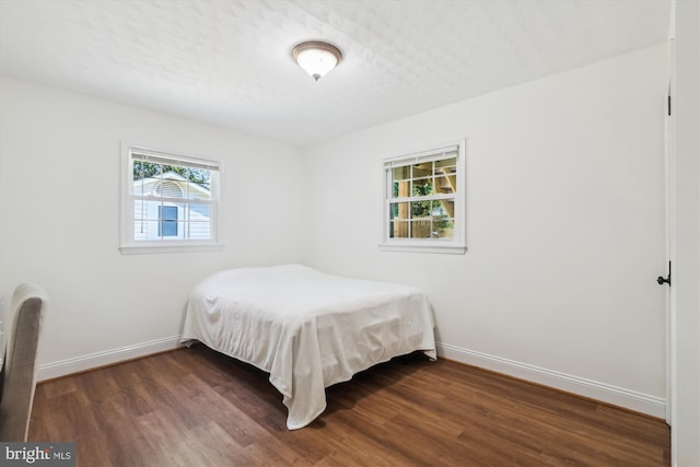 101 Oakmont Ct NE, Vienna, VA 22180 - bedroom featuring baseboards and dark wood-style floors
