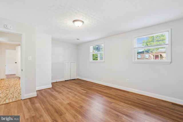 101 Oakmont Ct NE, Vienna, VA 22180 - spare room with light wood finished floors, baseboards, and a smoke detector