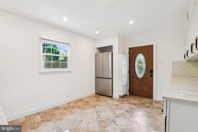 101 Oakmont Ct NE, Vienna, VA 22180 - kitchen featuring freestanding refrigerator, white cabinetry, backsplash, baseboards, and recessed lighting