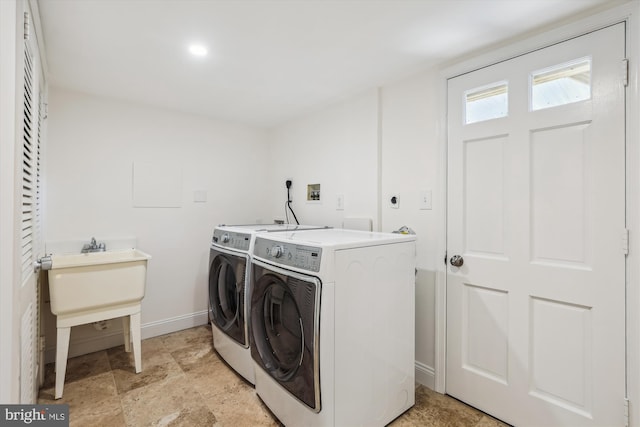 101 Oakmont Ct NE, Vienna, VA 22180 - washroom featuring washer and clothes dryer, baseboards, and light stone finish flooring