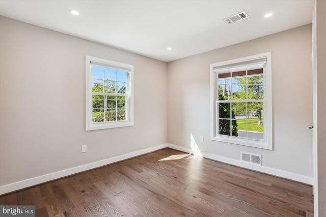 101 Oakmont Ct NE, Vienna, VA 22180 - unfurnished room with plenty of natural light, baseboards, wood finished floors, and recessed lighting