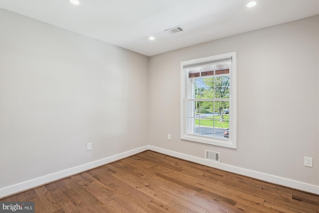 101 Oakmont Ct NE, Vienna, VA 22180 - unfurnished room featuring baseboards, wood finished floors, and recessed lighting
