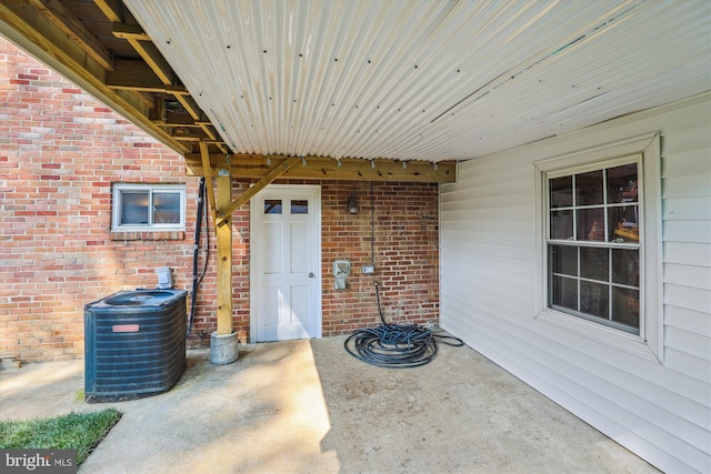 101 Oakmont Ct NE, Vienna, VA 22180 - view of exterior entry featuring central AC unit and brick siding