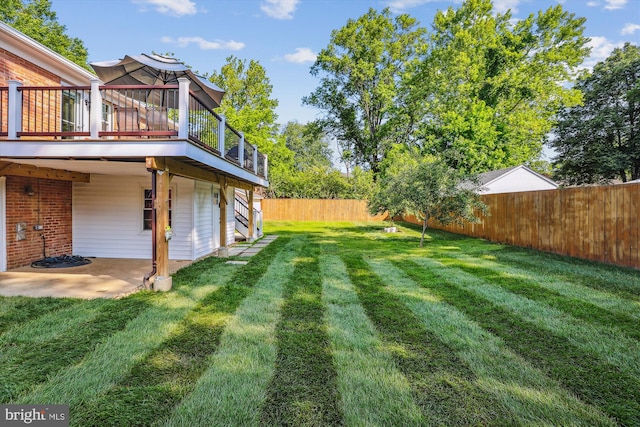101 Oakmont Ct NE, Vienna, VA 22180 - view of yard featuring a deck and a patio area