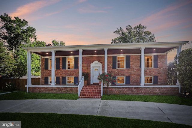 101 Oakmont Ct NE, Vienna, VA 22180 - view of front facade with brick siding and a porch