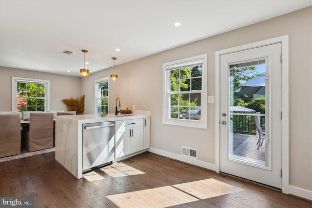 101 Oakmont Ct NE, Vienna, VA 22180 - kitchen with dishwasher, a sink, a peninsula, dark wood-type flooring, and white cabinetry