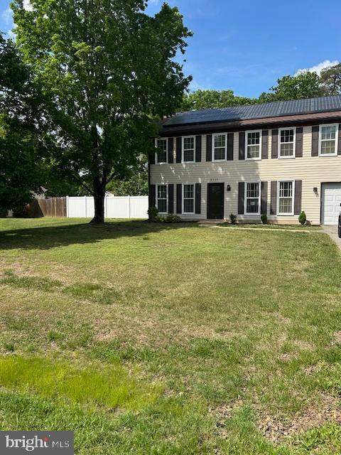 colonial-style house with an attached garage
