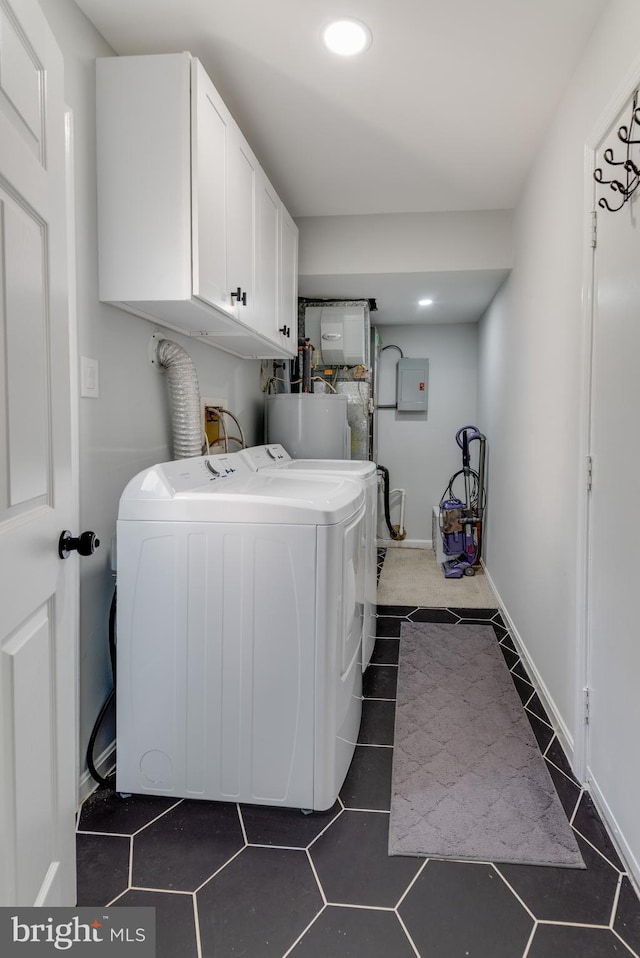 washroom featuring cabinet space, recessed lighting, washer and clothes dryer, water heater, and electric panel