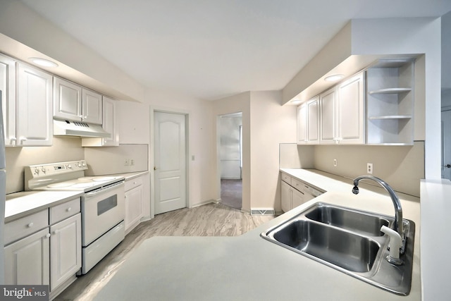 kitchen with a sink, light countertops, electric stove, white cabinetry, and under cabinet range hood