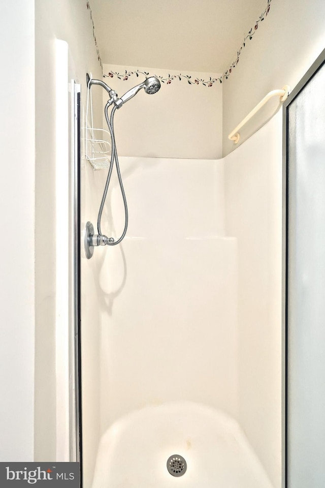 full bath featuring a stall shower