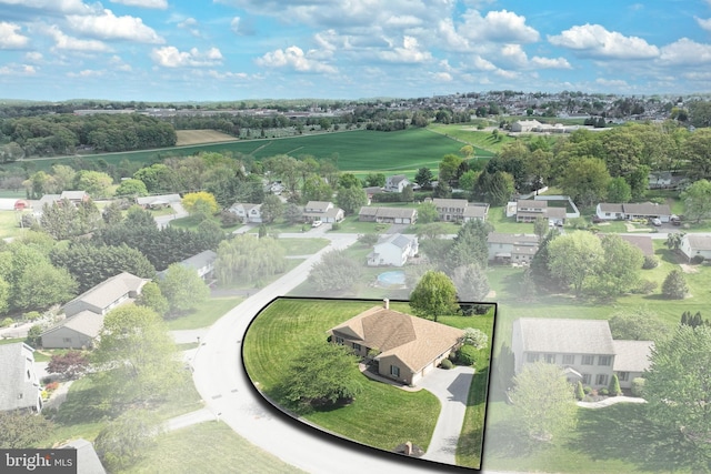 birds eye view of property with a residential view