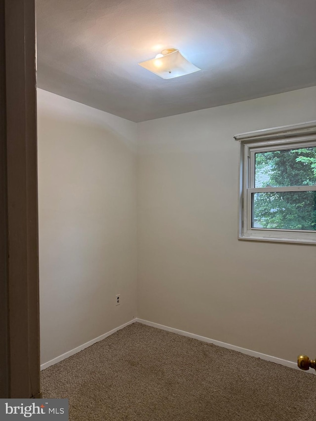 5119 19th St N, Arlington, VA 22207 - carpeted empty room with baseboards