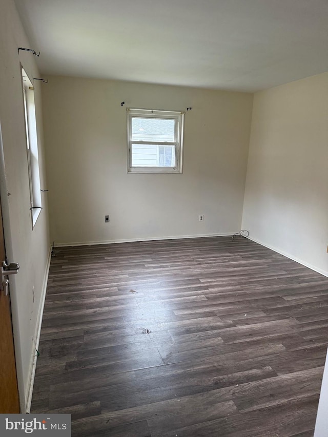 5119 19th St N, Arlington, VA 22207 - spare room with dark wood-style floors and baseboards